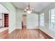 Formal dining room with hardwood floors, chandelier, and wainscoting at 3202 Misty Morn Ct, St Cloud, FL 34771