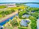 Aerial view of waterfront home with private dock and lush landscaping at 3202 Misty Morn Ct, St Cloud, FL 34771