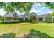 Two-story house with green siding, landscaping, and a walkway at 3202 Misty Morn Ct, St Cloud, FL 34771