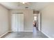 Well-lit bedroom with double doors and wood-look floors at 3202 Misty Morn Ct, St Cloud, FL 34771