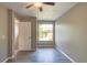 Bedroom with ceiling fan and large window at 3202 Misty Morn Ct, St Cloud, FL 34771