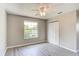 Bright bedroom with window and bifold closet doors at 3202 Misty Morn Ct, St Cloud, FL 34771