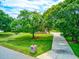 Home with driveway, large yard, and mature trees at 3202 Misty Morn Ct, St Cloud, FL 34771