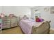 bedroom with light purple bedding and dresser at 9226 Longfellow Pl, Apopka, FL 32703
