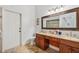 Bathroom with double vanity and granite countertops at 9226 Longfellow Pl, Apopka, FL 32703