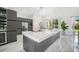Modern kitchen with a large island and stainless steel appliances at 9226 Longfellow Pl, Apopka, FL 32703