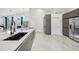 Modern kitchen with large island, stainless steel appliances and white quartz countertops at 9226 Longfellow Pl, Apopka, FL 32703