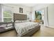 Large bedroom with king-size bed and access to the patio at 9226 Longfellow Pl, Apopka, FL 32703