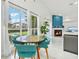 Bright dining area with a round table and teal chairs at 9226 Longfellow Pl, Apopka, FL 32703