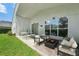 Relaxing patio with seating area and fire pit, perfect for outdoor entertaining at 9226 Longfellow Pl, Apopka, FL 32703