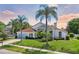 Beautiful home with a light blue garage door and palm trees at 9226 Longfellow Pl, Apopka, FL 32703