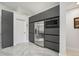 Modern kitchen featuring stainless steel appliances and dark gray cabinetry at 9226 Longfellow Pl, Apopka, FL 32703