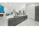 Modern kitchen with large island, stainless steel appliances and white quartz countertops at 9226 Longfellow Pl, Apopka, FL 32703