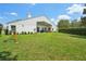 Expansive backyard with lush grass, a patio, and a play area at 9226 Longfellow Pl, Apopka, FL 32703