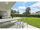 Private backyard with grassy lawn and patio seating at 9226 Longfellow Pl, Apopka, FL 32703