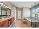 Elegant bathroom with double vanity, soaking tub, and shower at 9226 Longfellow Pl, Apopka, FL 32703