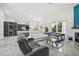 Spacious living room, open to kitchen and backyard access at 9226 Longfellow Pl, Apopka, FL 32703