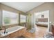 Bathroom with garden tub, shower, and view to bedroom at 9226 Longfellow Pl, Apopka, FL 32703