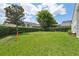 Backyard with grassy area and hockey net at 9226 Longfellow Pl, Apopka, FL 32703