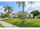 House exterior with palm trees and landscaping at 9226 Longfellow Pl, Apopka, FL 32703