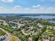 Wide aerial view of a residential area near a lake at 9226 Longfellow Pl, Apopka, FL 32703
