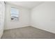 Well-lit bedroom featuring grey carpet and a window with blinds at 2008 Rosewood Dr, Bartow, FL 33830