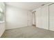 Spacious bedroom with grey carpet and double doors at 2012 Rosewood Dr, Bartow, FL 33830