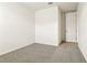 Empty bedroom with grey carpet and door at 2012 Rosewood Dr, Bartow, FL 33830