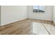 Bright bedroom with wood-look tile floor and large window at 2012 Rosewood Dr, Bartow, FL 33830