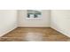 Bright bedroom with wood-look tile flooring and window at 2012 Rosewood Dr, Bartow, FL 33830