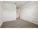 Empty bedroom with grey carpet and door at 2012 Rosewood Dr, Bartow, FL 33830
