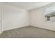 Bright bedroom with grey carpet and window at 2012 Rosewood Dr, Bartow, FL 33830