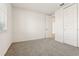 Empty bedroom with grey carpet and door at 2012 Rosewood Dr, Bartow, FL 33830