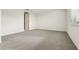 Spacious bedroom with gray carpeting and a window at 2012 Rosewood Dr, Bartow, FL 33830