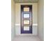 Modern dark-stained front door with glass panels at 2012 Rosewood Dr, Bartow, FL 33830