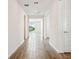 Bright and spacious hallway with wood-look tile floors at 2012 Rosewood Dr, Bartow, FL 33830