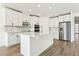 Modern kitchen with white cabinets, an island, and stainless steel appliances at 2012 Rosewood Dr, Bartow, FL 33830