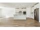 Modern kitchen featuring white cabinets, a large island, and stainless steel appliances at 2012 Rosewood Dr, Bartow, FL 33830