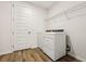 Laundry room with washer, dryer, and shelving at 2012 Rosewood Dr, Bartow, FL 33830