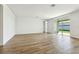 Spacious living room with tile flooring and sliding glass doors at 2012 Rosewood Dr, Bartow, FL 33830
