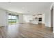 Living room with kitchen and water view from sliding glass doors at 2012 Rosewood Dr, Bartow, FL 33830