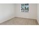 Spacious bedroom with carpeted floors and a window at 2020 Rosewood Dr, Bartow, FL 33830