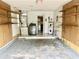 Garage with washer, dryer, water heater, and built-in shelving at 5407 Blueberry Dr, Orlando, FL 32811