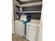 Laundry room with washer and dryer, shelving and tile floor at 2927 Camden Way, Davenport, FL 33837