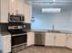 Modern kitchen featuring stainless steel appliances and ample counter space at 2927 Camden Way, Davenport, FL 33837