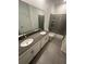 Double vanity bathroom with a large walk-in shower at 2927 Camden Way, Davenport, FL 33837