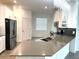 Modern kitchen with stainless steel appliances and a large island at 2927 Camden Way, Davenport, FL 33837