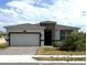Modern one-story home with a two-car garage at 2927 Camden Way, Davenport, FL 33837