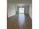 Bright and airy living room with tile floors and access to a lake view at 2927 Camden Way, Davenport, FL 33837