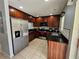 Modern kitchen with stainless steel appliances and dark wood cabinets at 5434 River Rock Rd, Lakeland, FL 33809